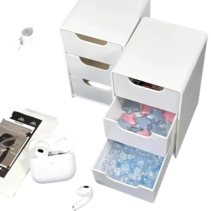White plastic desk organizer with three transparent drawers and rounded handles filled with colorful wrapped items