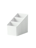 White plastic desk organizer with three angled compartments for holding remotes and office supplies
