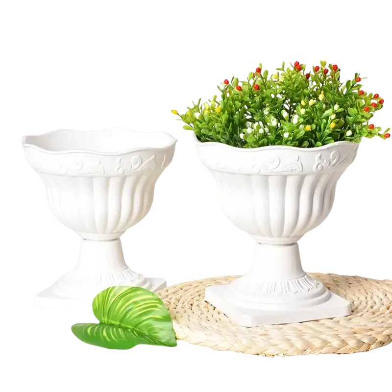White plastic roman column planter pot with white ceramic urn shape fluted sides and ornate embossed detailing
