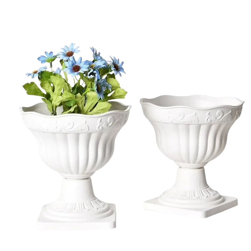 White plastic roman column planter pot featuring white ceramic urns with ornate fluted detailing and scalloped rims