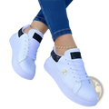 White platform sneakers with black glitter accents and a gold bee emblem on the side