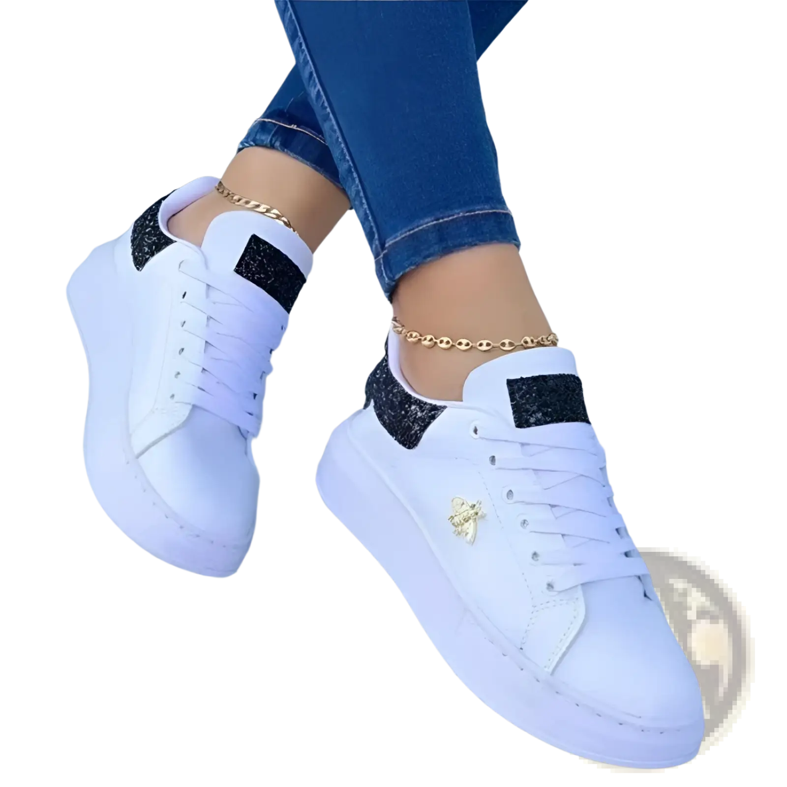 White platform sneakers with black glitter accents and a gold bee emblem on the side