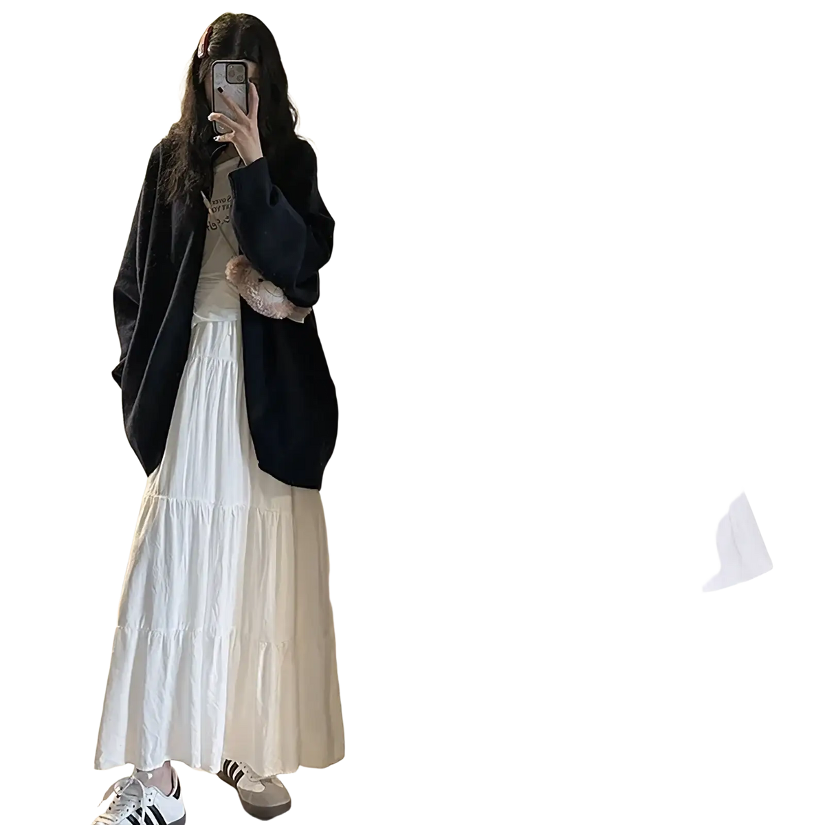 White pleated tiered maxi skirt with a high-waisted flowing design made from lightweight fabric