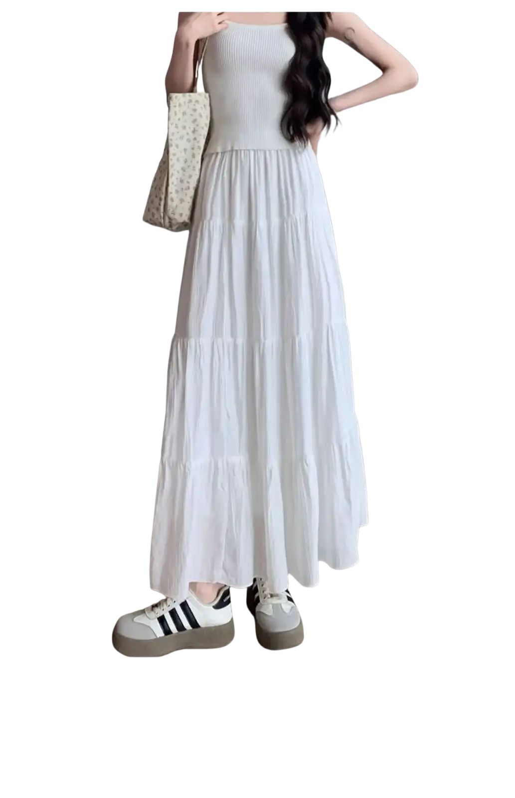 White pleated tiered maxi skirt featuring a flowing white tiered design with a ribbed bodice in soft lightweight fabric