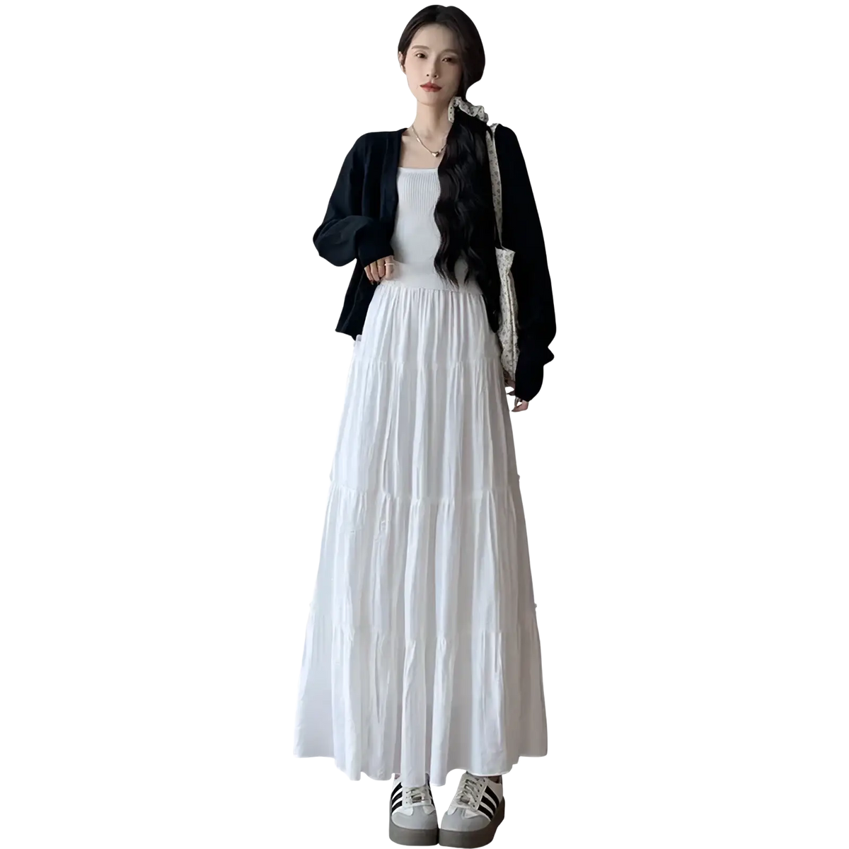 White pleated tiered maxi skirt with flowing lightweight fabric and subtle pleats for elegant casual wear