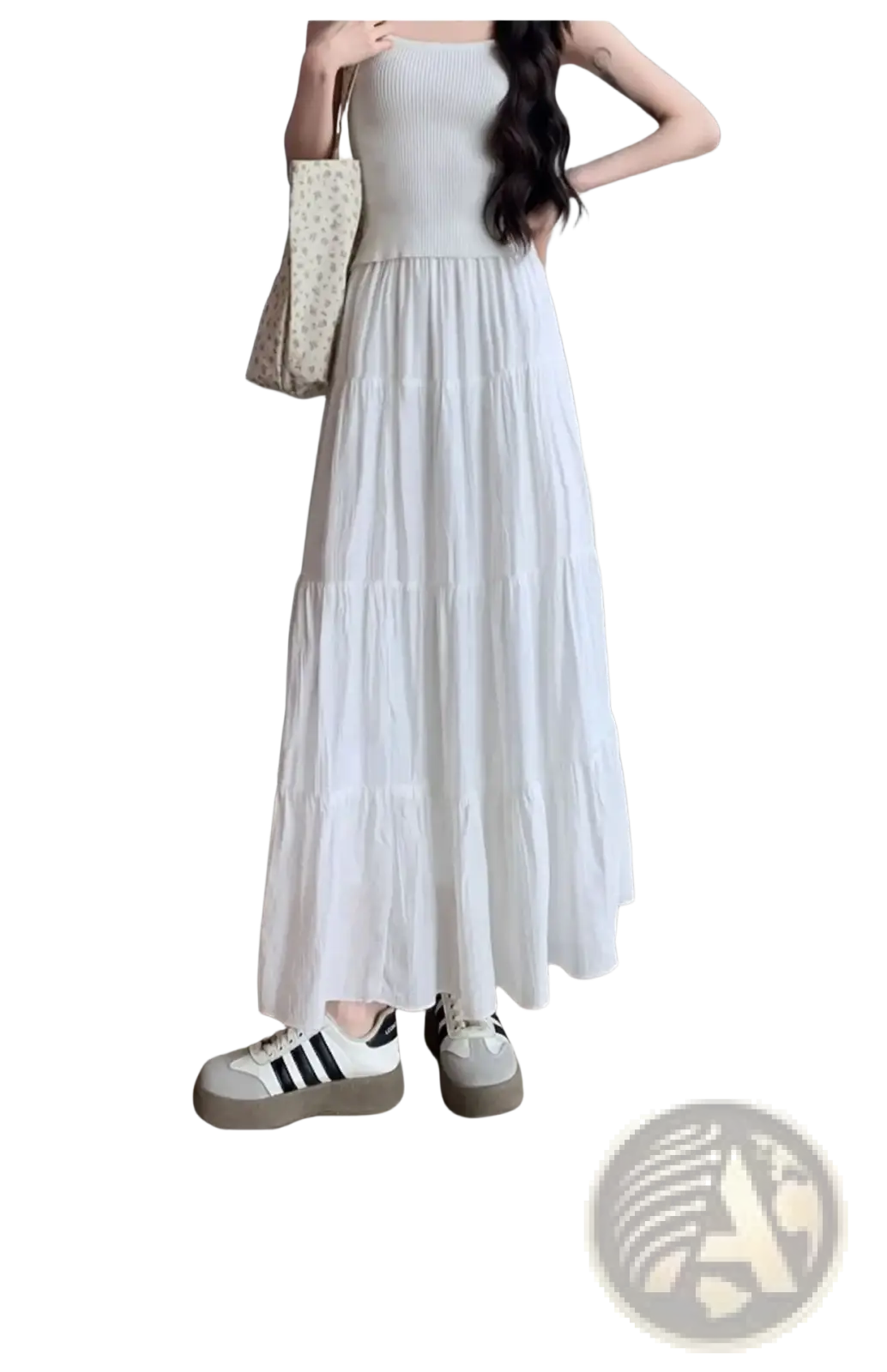 White pleated tiered maxi skirt featuring a flowing white tiered design with a ribbed bodice in soft lightweight fabric
