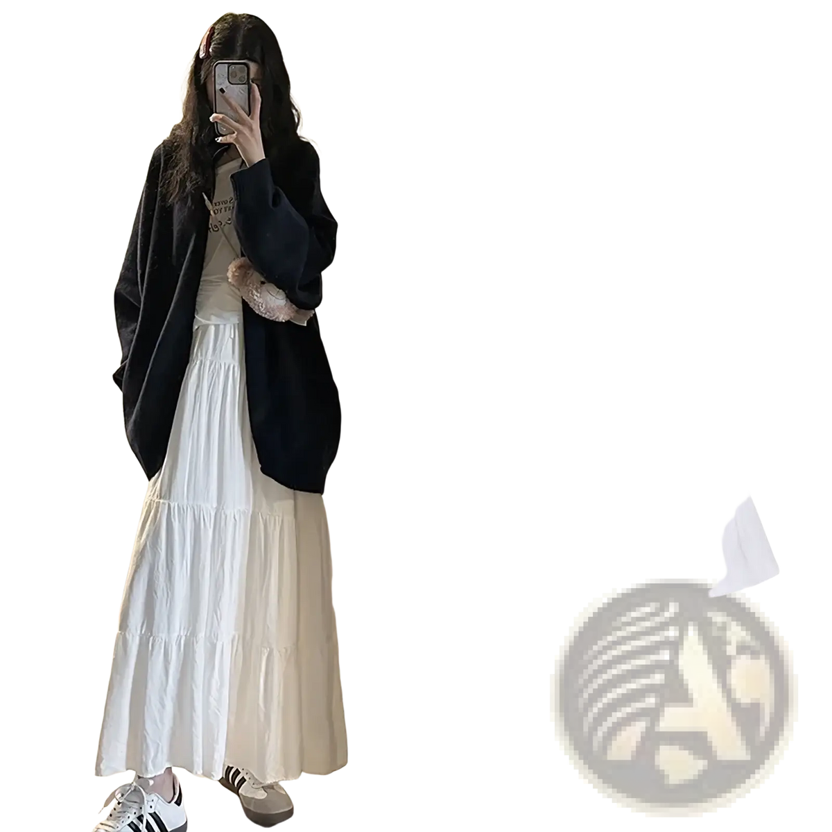 White pleated tiered maxi skirt with a high-waisted flowing design made from lightweight fabric
