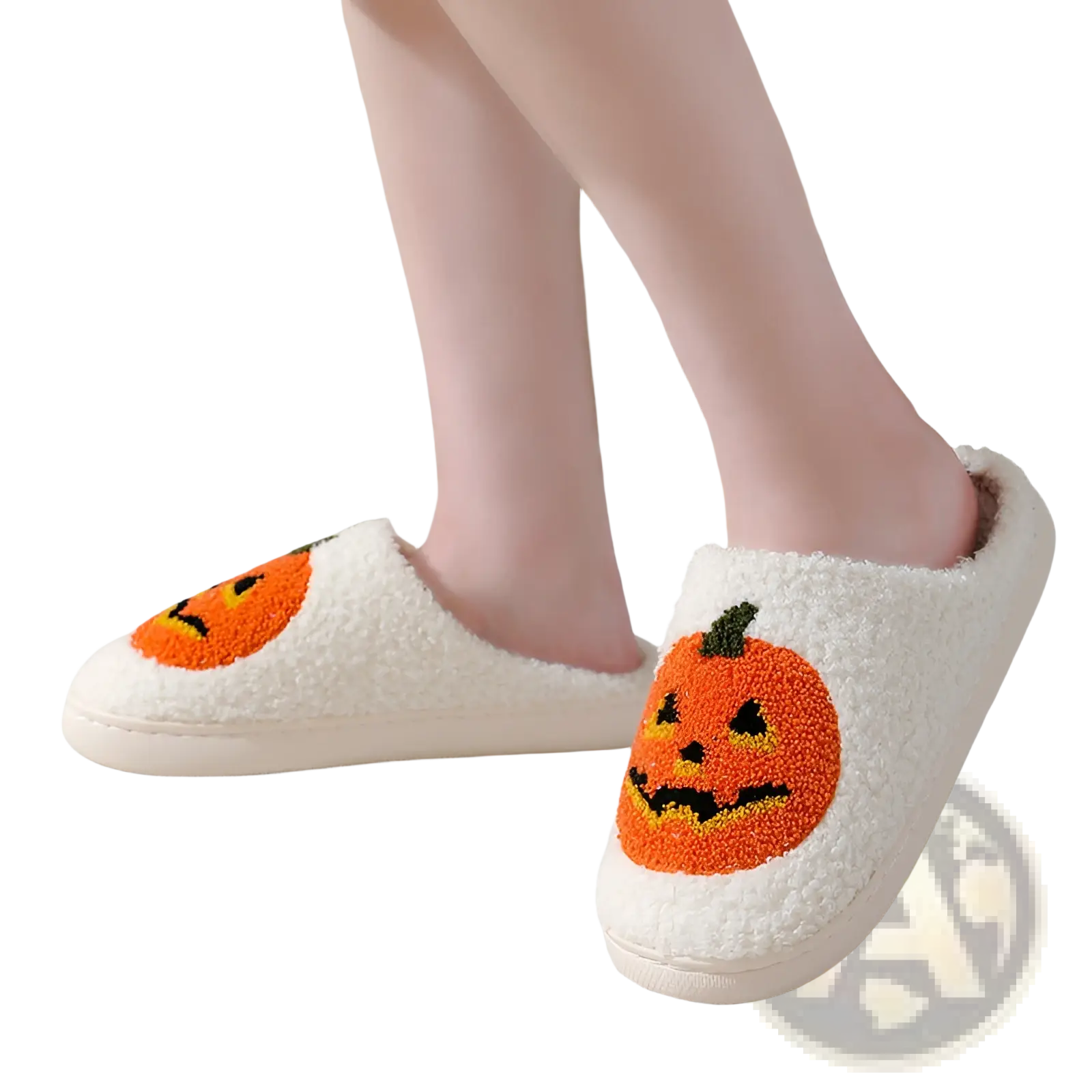 White plush Halloween slippers with embroidered orange jack-o-lantern faces featuring black and yellow details