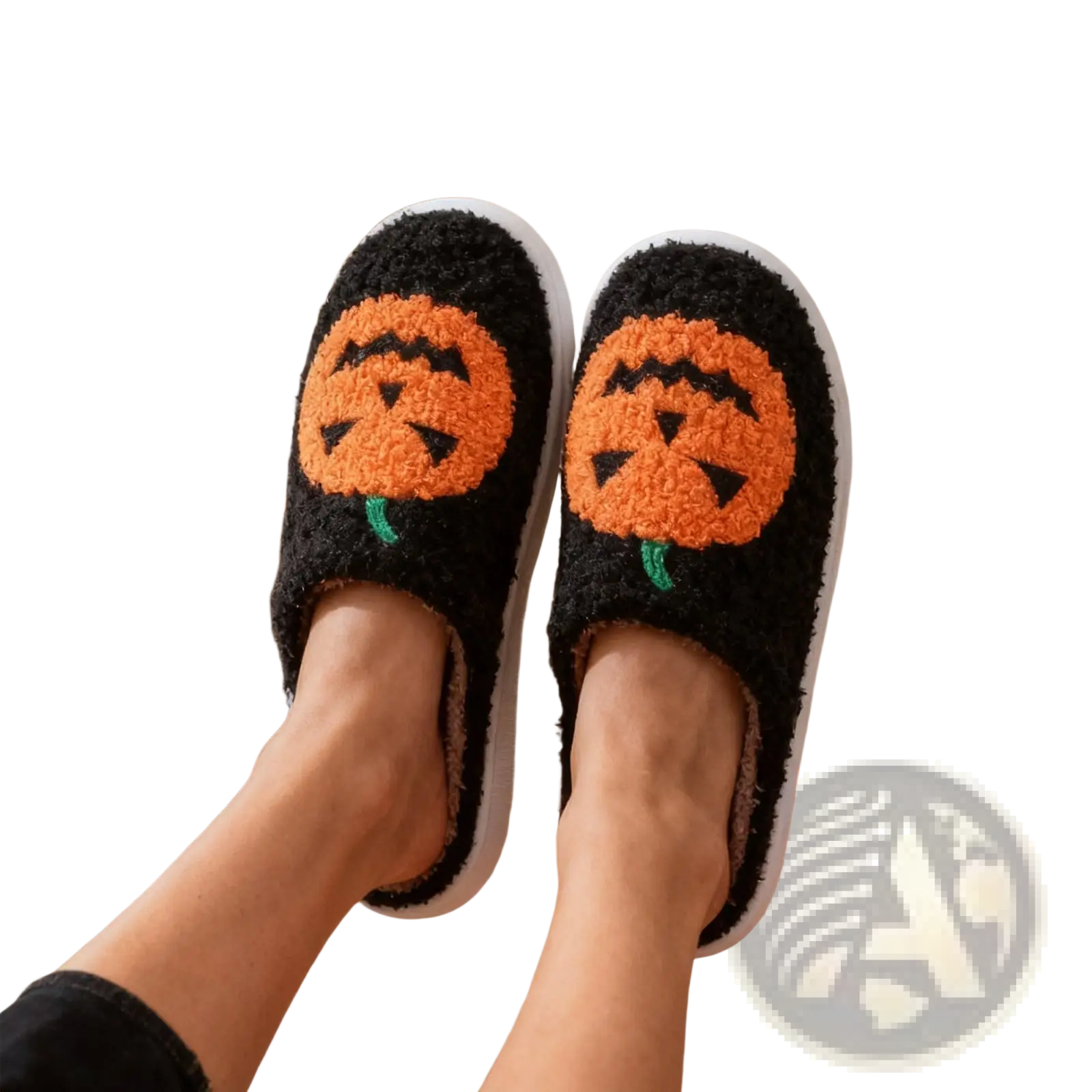 Black fuzzy halloween slippers with orange jack-o-lantern embroidery and white soles in white plush design