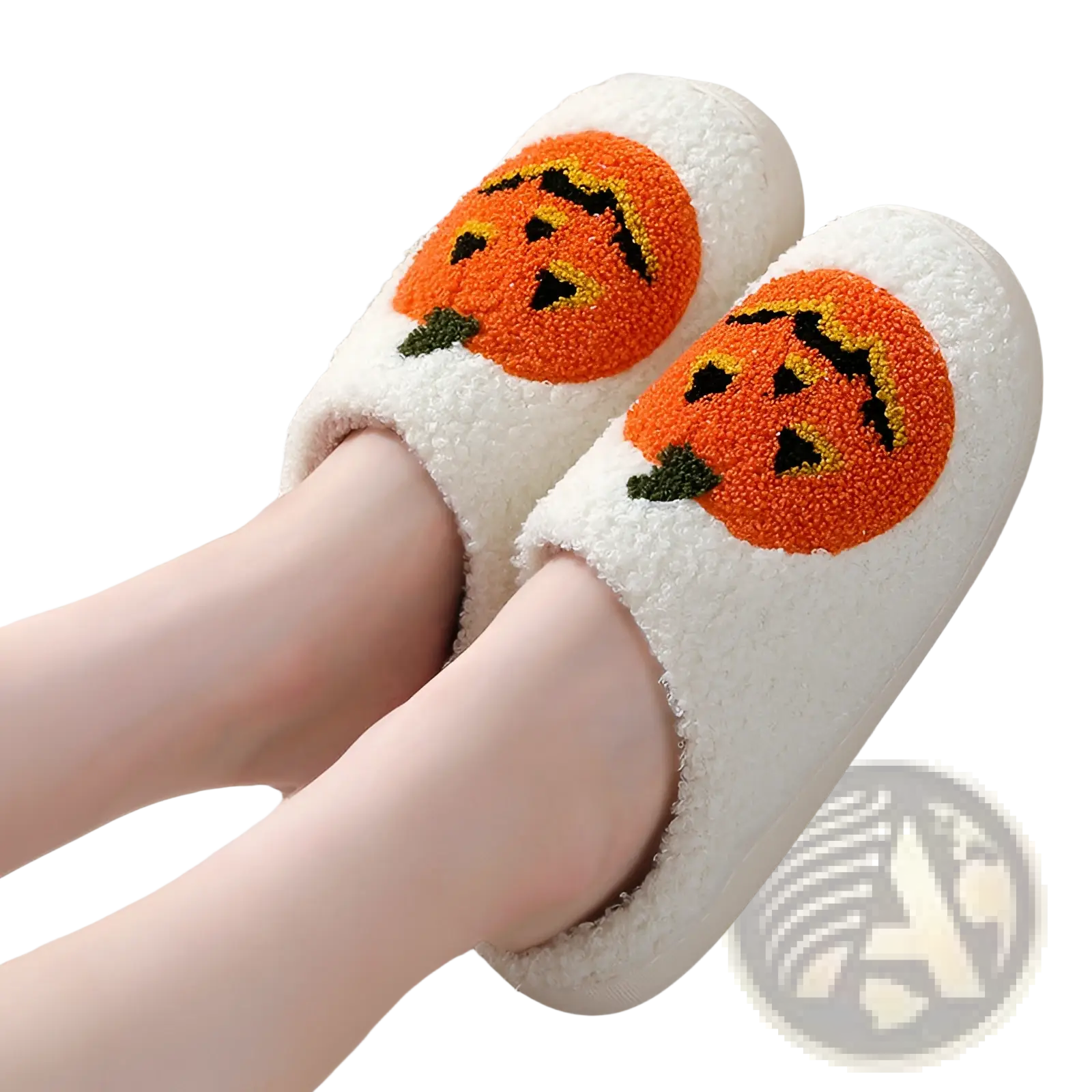 White plush halloween slippers with embroidered orange jack-o-lantern faces featuring black and yellow details
