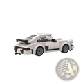 White porsche 911 building blocks speed champions set with black and white lego model featuring gray wheels and aerodynamic design