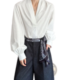 White satin puff sleeve blouse with voluminous long sleeves v-neckline tied at the waist with black patterned bandana