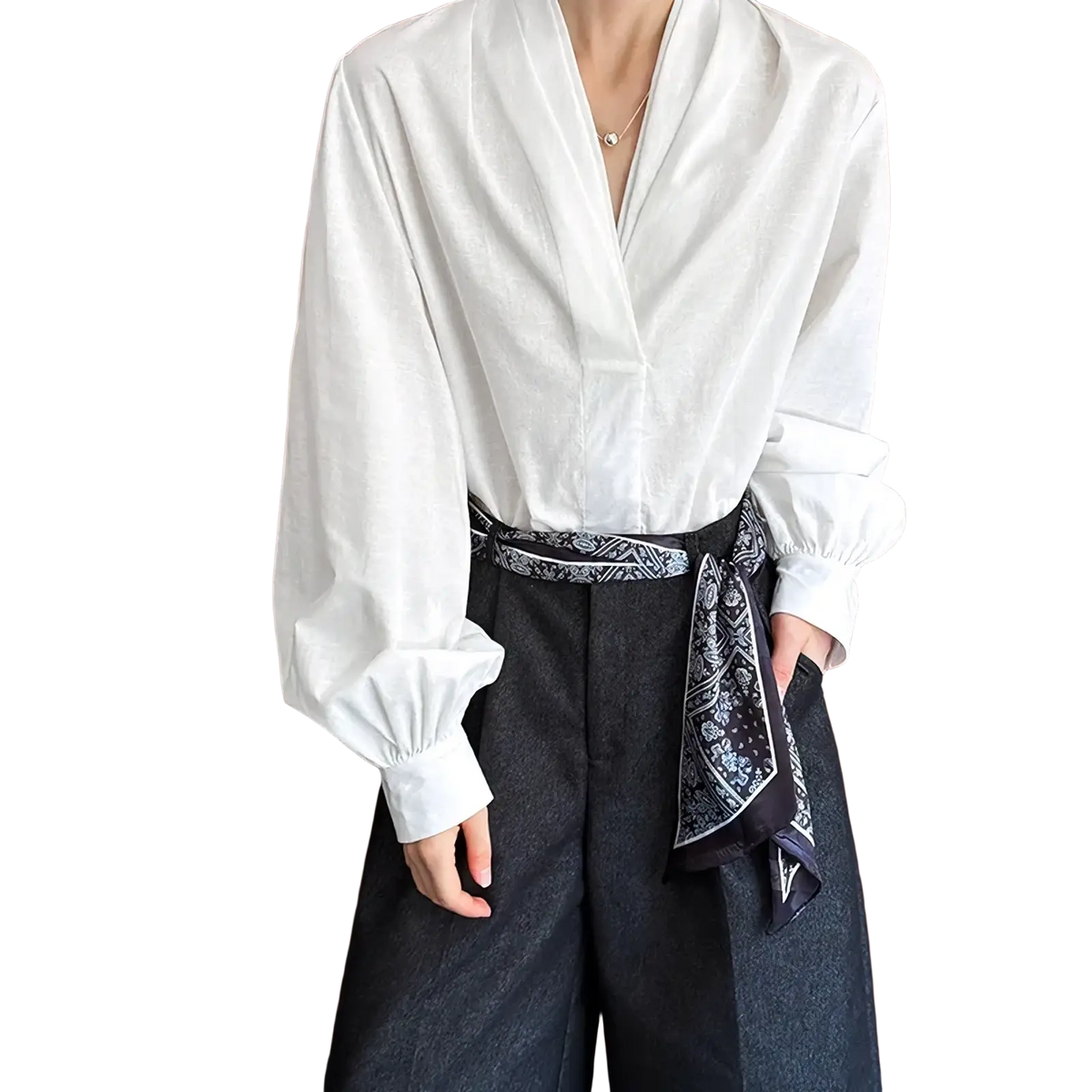 White puff sleeve v-neck blouse in lightweight fabric featuring long sleeves and a relaxed fit perfect for layering