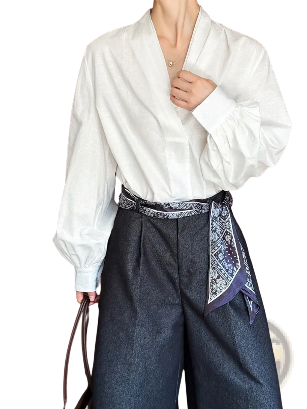 White puff sleeve v neck blouse in lightweight fabric with long loose fit and voluminous cuffs for elegant wear