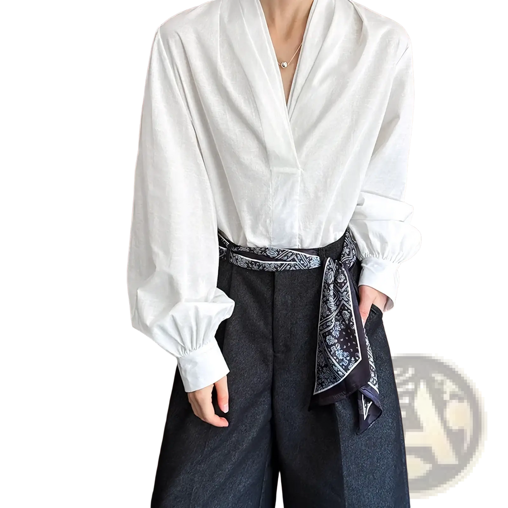 White puff sleeve v-neck blouse in lightweight fabric featuring long sleeves and a relaxed fit perfect for layering