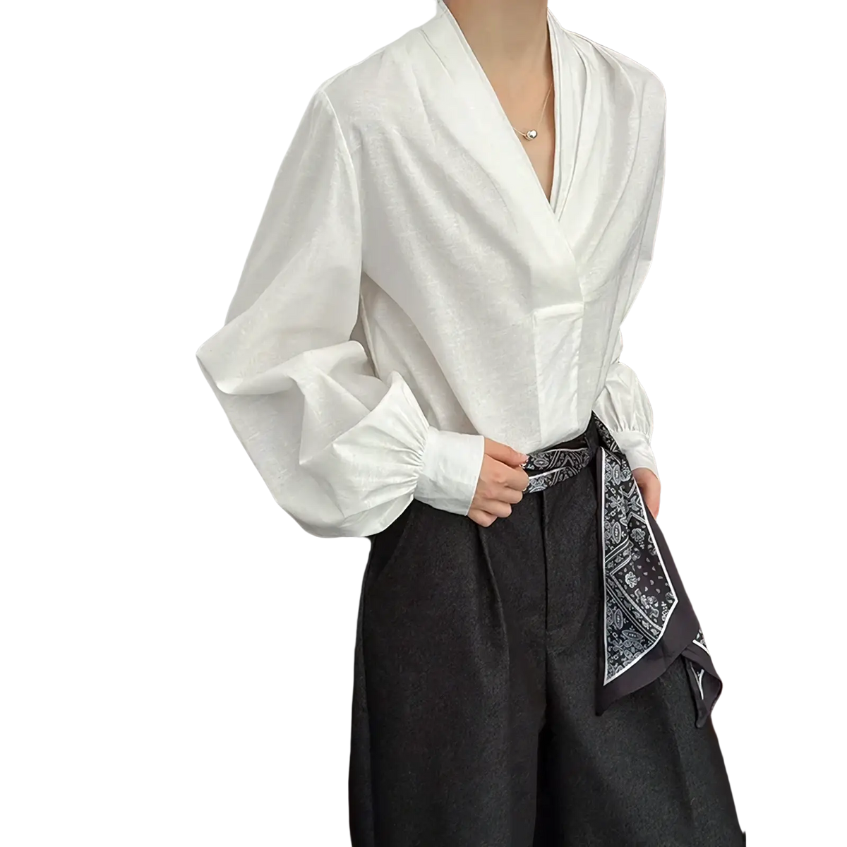 White puff sleeve v-neck blouse featuring voluminous puff sleeves and a v-neckline in lightweight fabric