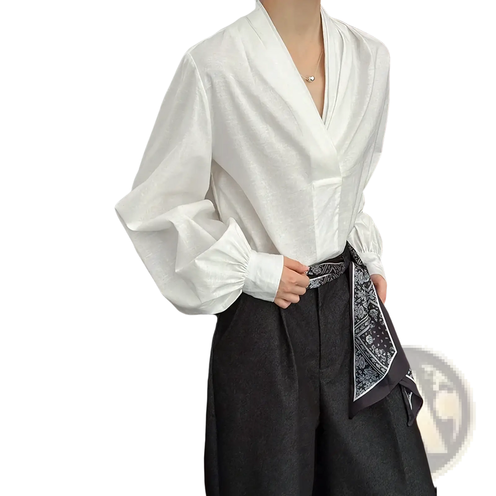 White puff sleeve v-neck blouse featuring voluminous puff sleeves and a v-neckline in lightweight fabric