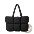 Black quilted puffer tote bag with padded handles made of soft cotton suitable for everyday use