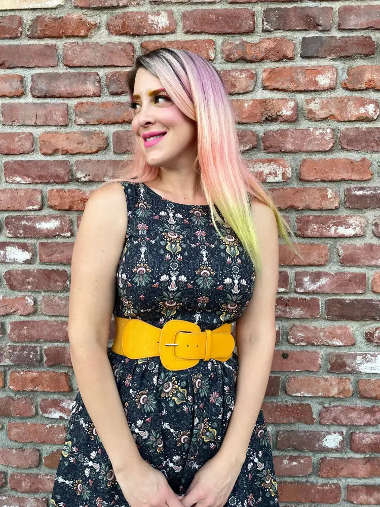 White rabbit black floral midi dress with bright yellow belt featuring a rectangular buckle at the waist