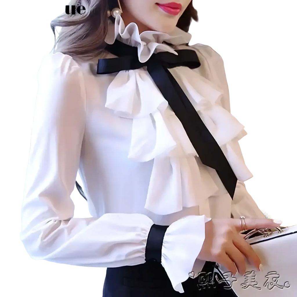 White ruffled bow long sleeve blouse with black bow tie, matching cuffs, and delicate lace collar in white fabric