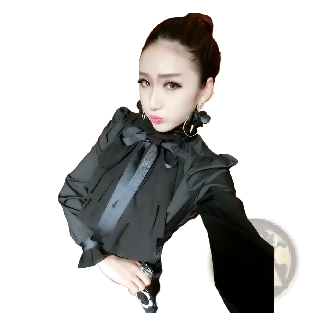 Black ruffled blouse with prominent bow at neckline featuring long sleeves in a stylish formal design