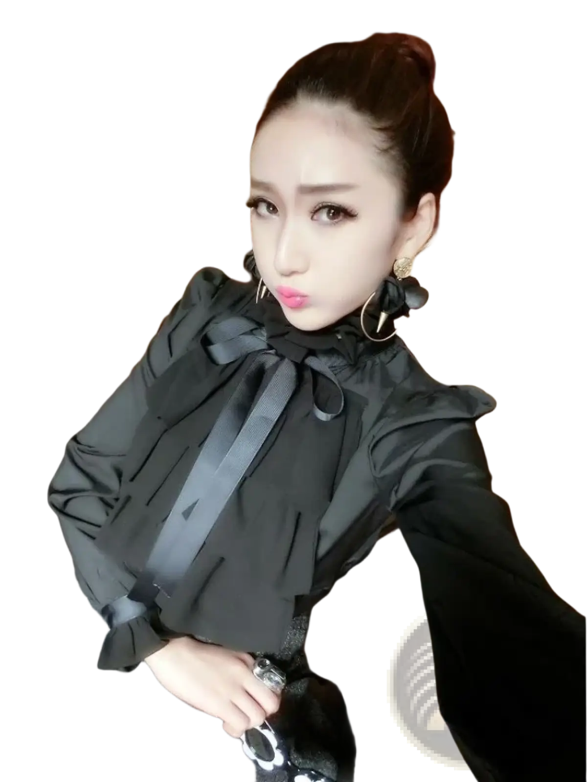 Black long sleeve ruffled blouse with a prominent bow at the neckline made of lightweight fabric