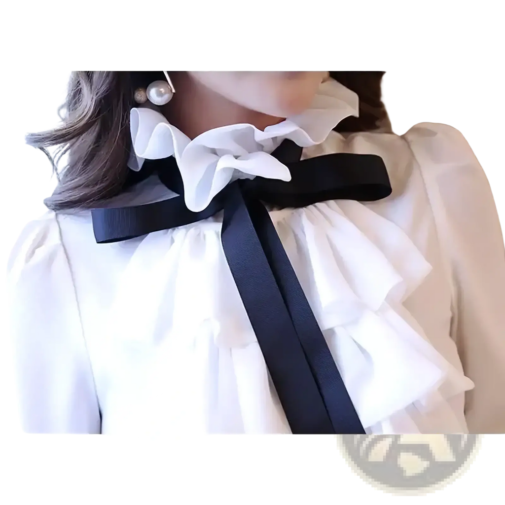 White ruffled bow long sleeve blouse featuring a black satin bow at the neckline in a white soft fabric