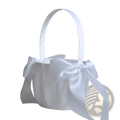 White satin flower girl basket with pearl bow, curved handle, and decorative bows for weddings and events
