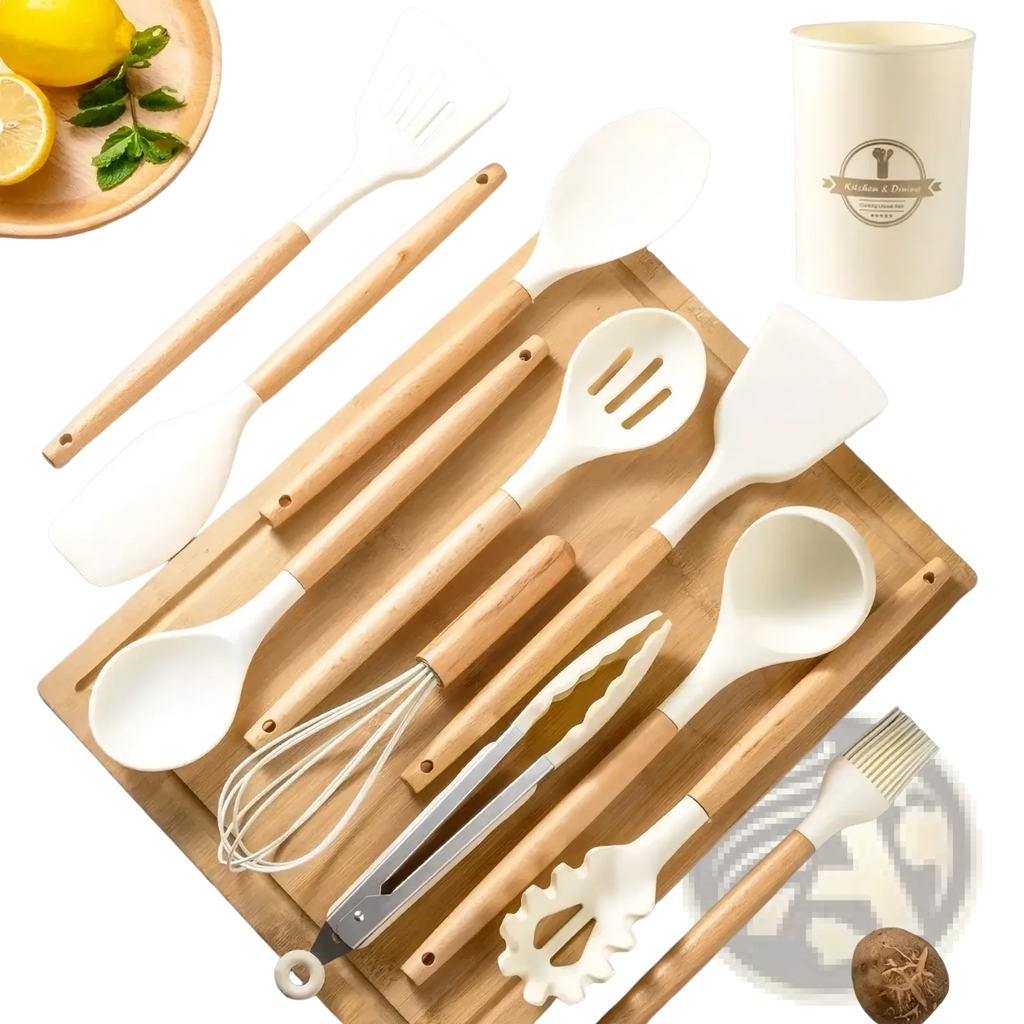 Set of white silicone kitchen utensils with wooden handles arranged on bamboo cutting board for cooking