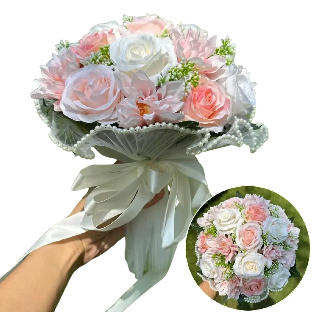 White silk rose wedding bouquet with soft pink and white artificial roses accented by lace pearls and satin ribbon bow
