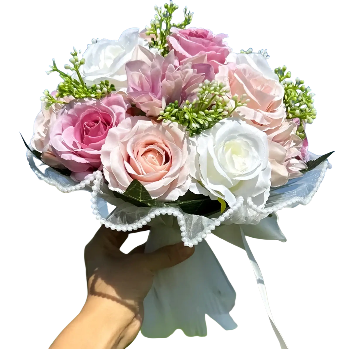 A delicate white silk rose wedding bouquet with soft pink and white artificial roses wrapped in lace and accented with pearls