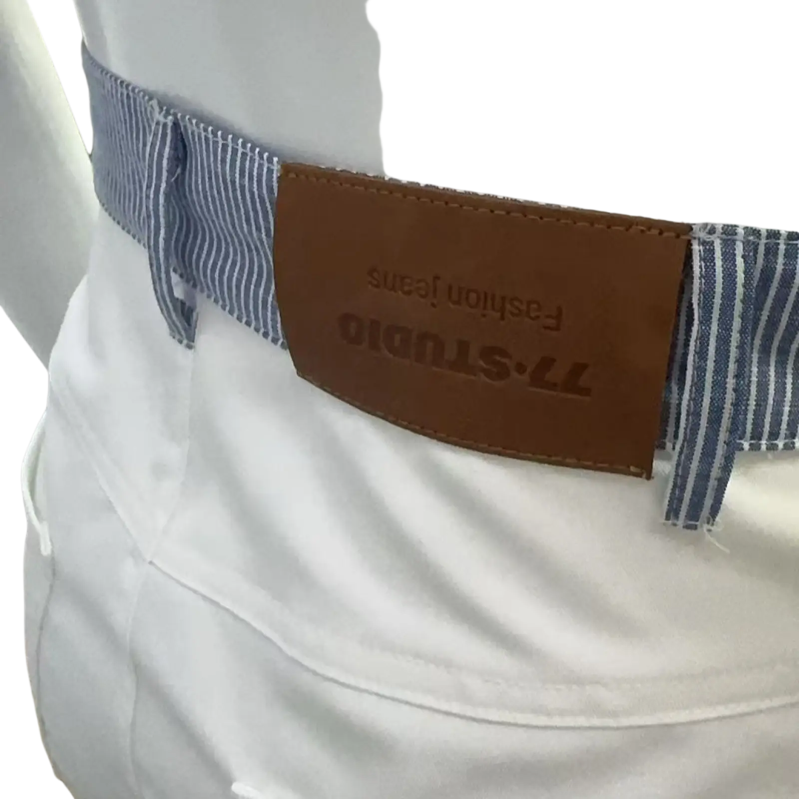White striped waistband wide leg jeans with blue and white striped fabric belt and brown leather tab embossed text