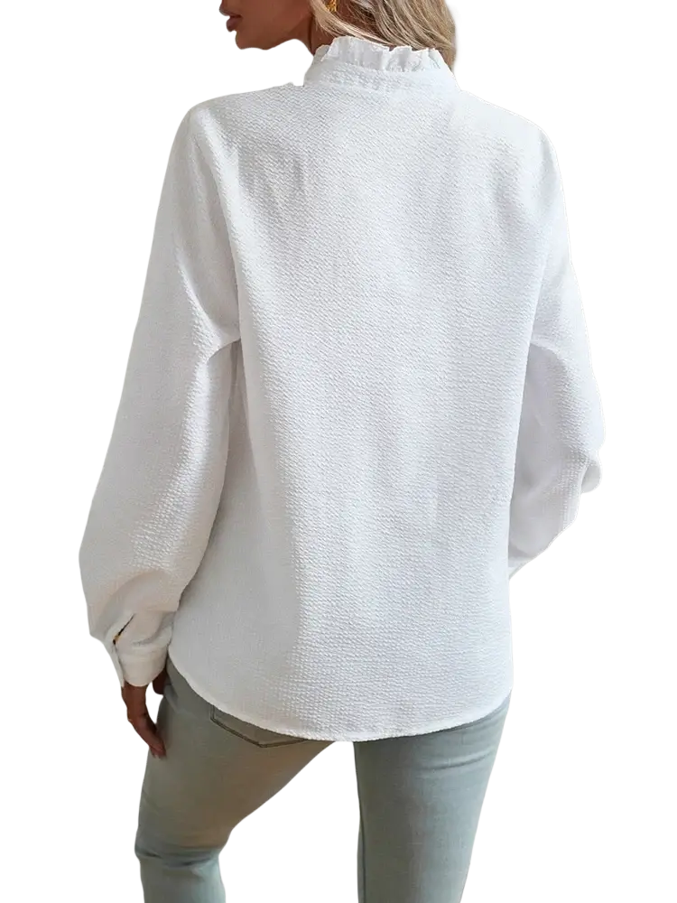 White textured long sleeve blouse with ruffled high neckline showcasing elegant fabric detail and design