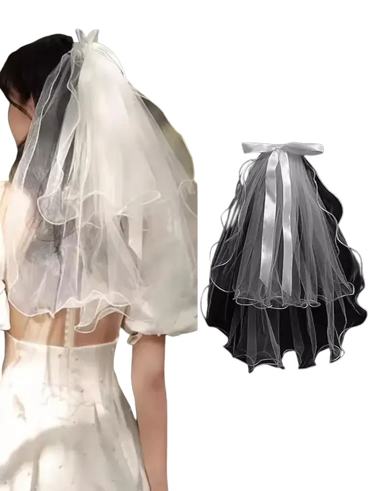White tulle bow bridal veil with delicate satin ribbon bow, layered ruffles, and elegant sheer design