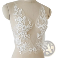 White wedding dress lace applique pair featuring white floral lace with delicate embroidery and sheer mesh backing