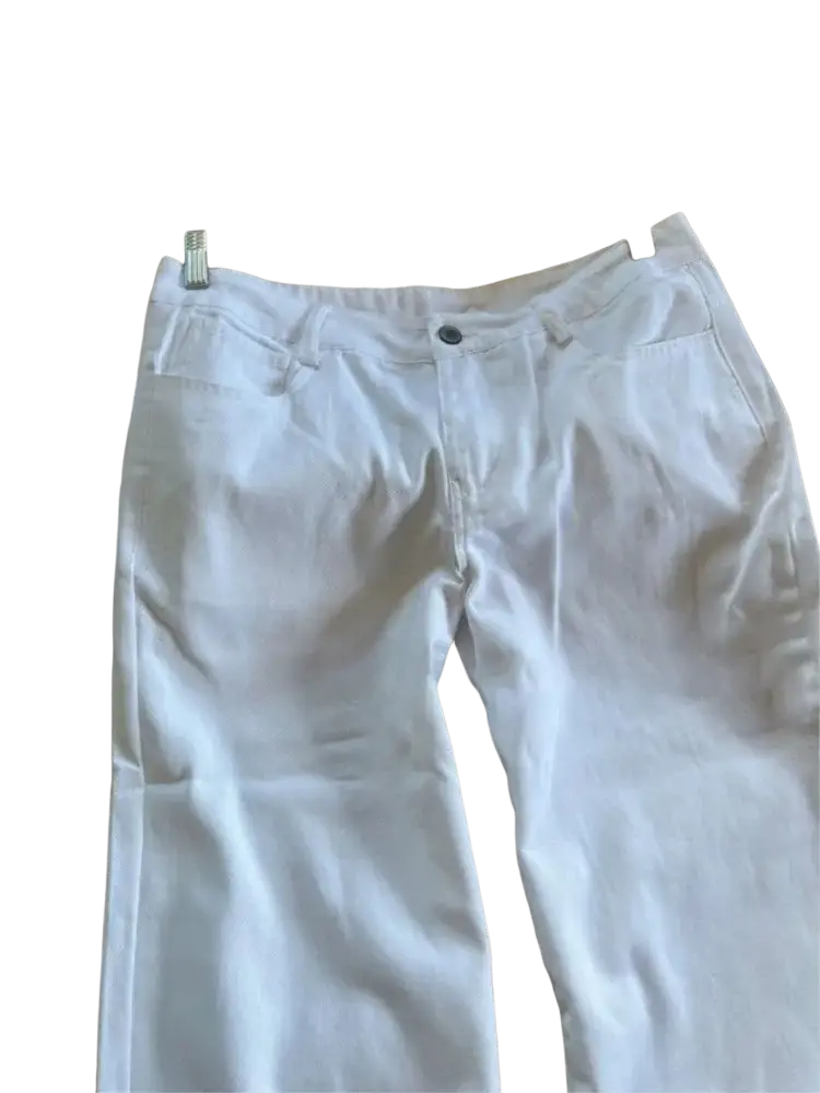 White wide leg denim pants made of white denim fabric hanging on a wooden hanger