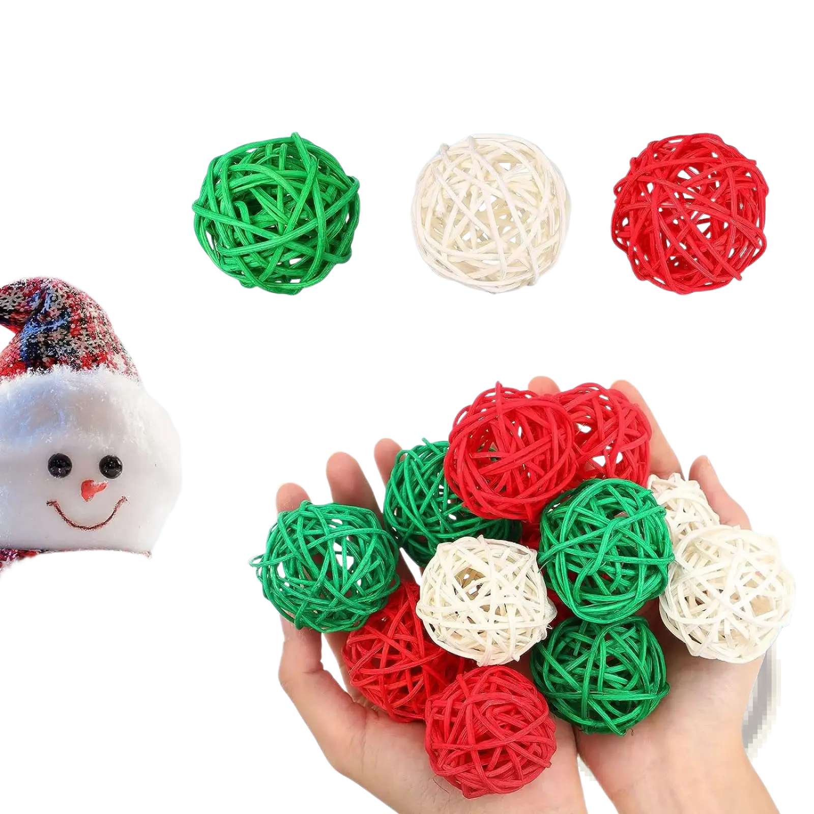 Hand holding small woven wicker rattan balls in red green and white for christmas vase filler orbs 30pc set