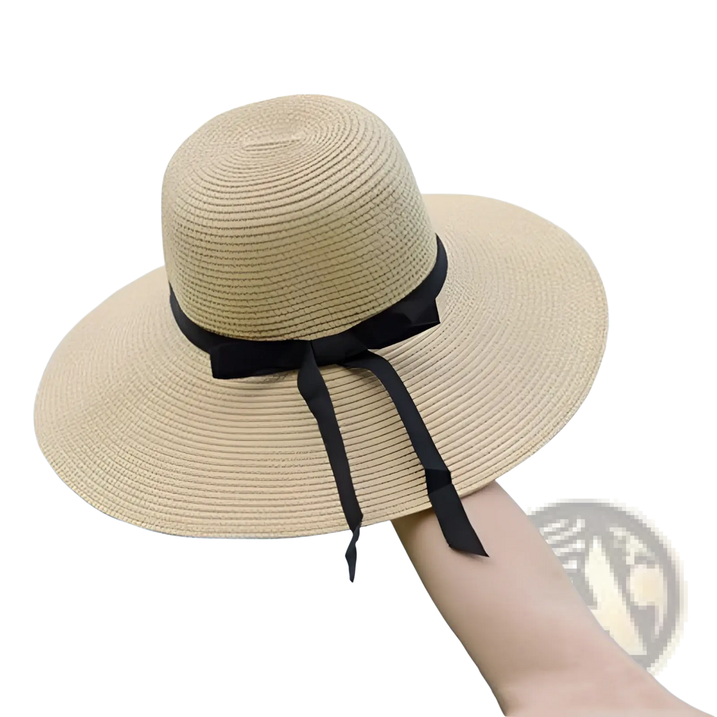 Beige wide brim straw sun hat with a black ribbon bow suitable for sun protection and stylish outdoor wear