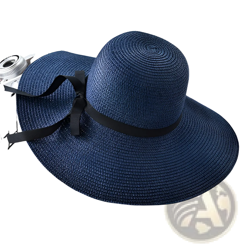 A navy blue wide brim straw sun hat with a black ribbon bow designed for sun protection and style