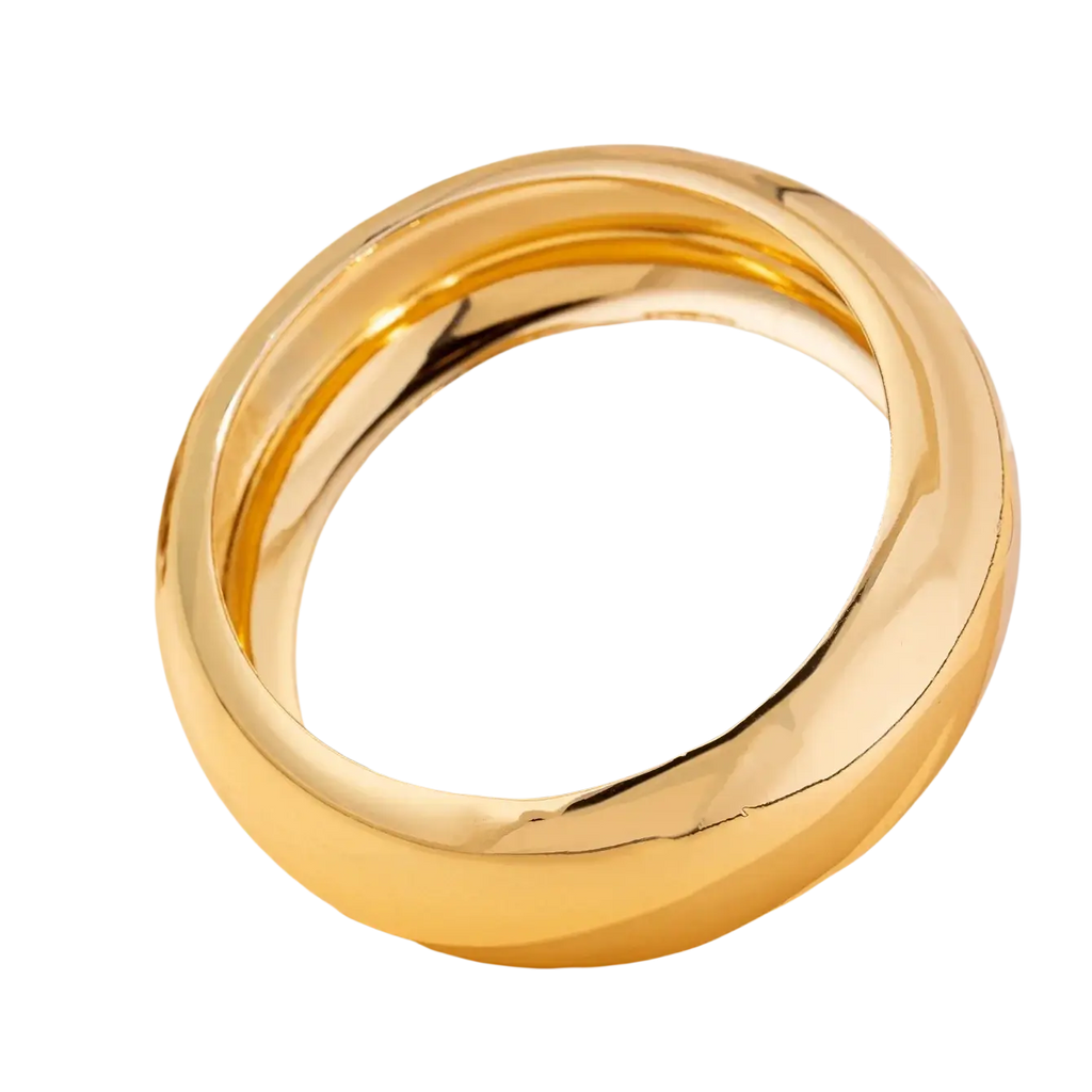 A sleek wide gold bangle bracelet for women with a polished, smooth, rounded design and reflective surface