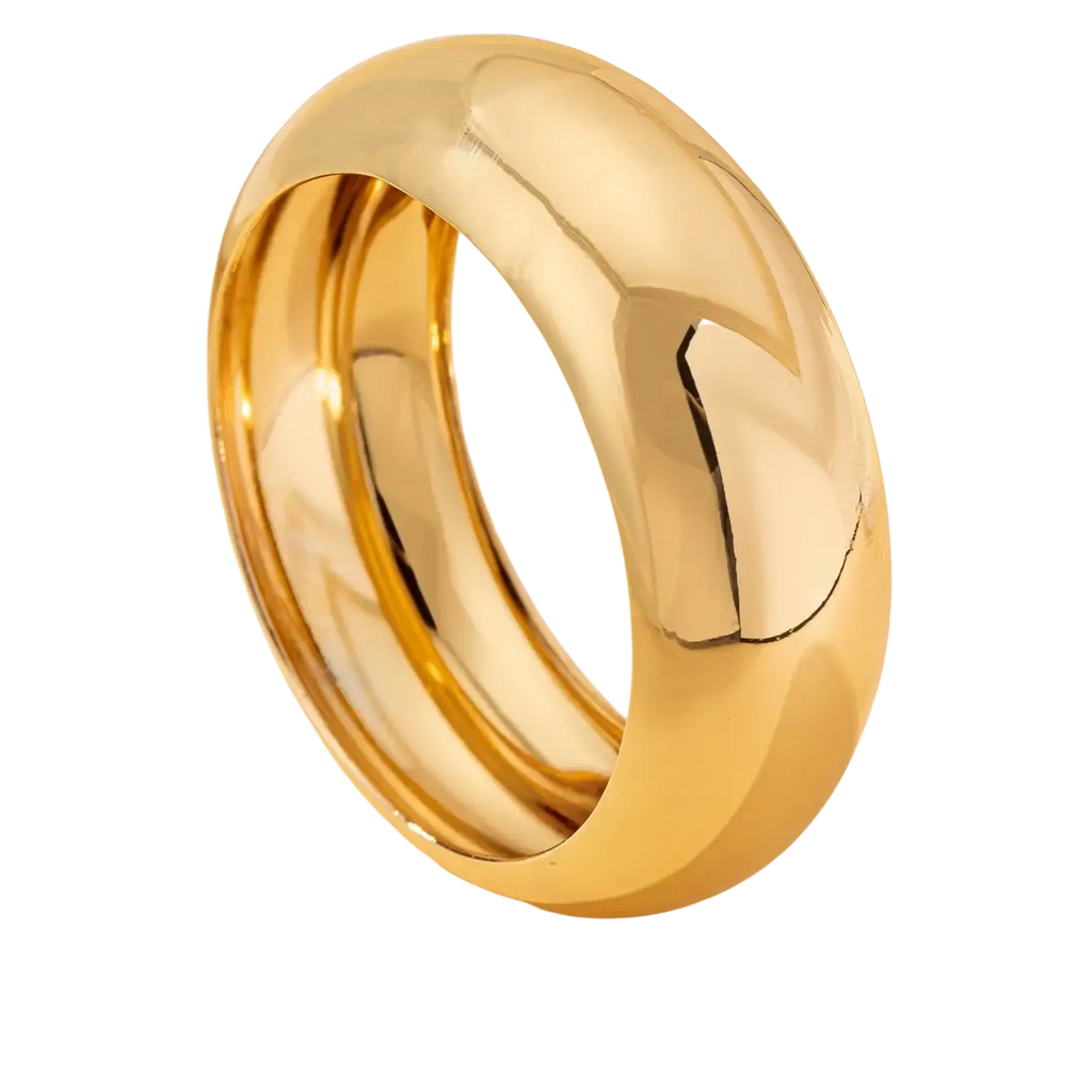 Wide gold bangle bracelet for women in polished gold-toned stainless steel with smooth rounded band and subtle engraving