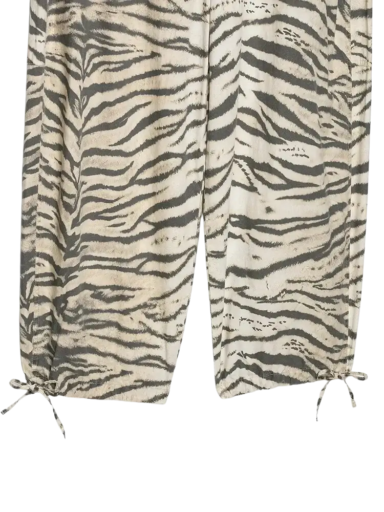 Wide leg tiger-striped cotton joggers with drawstring cuffs featuring an animal print cargo pant style