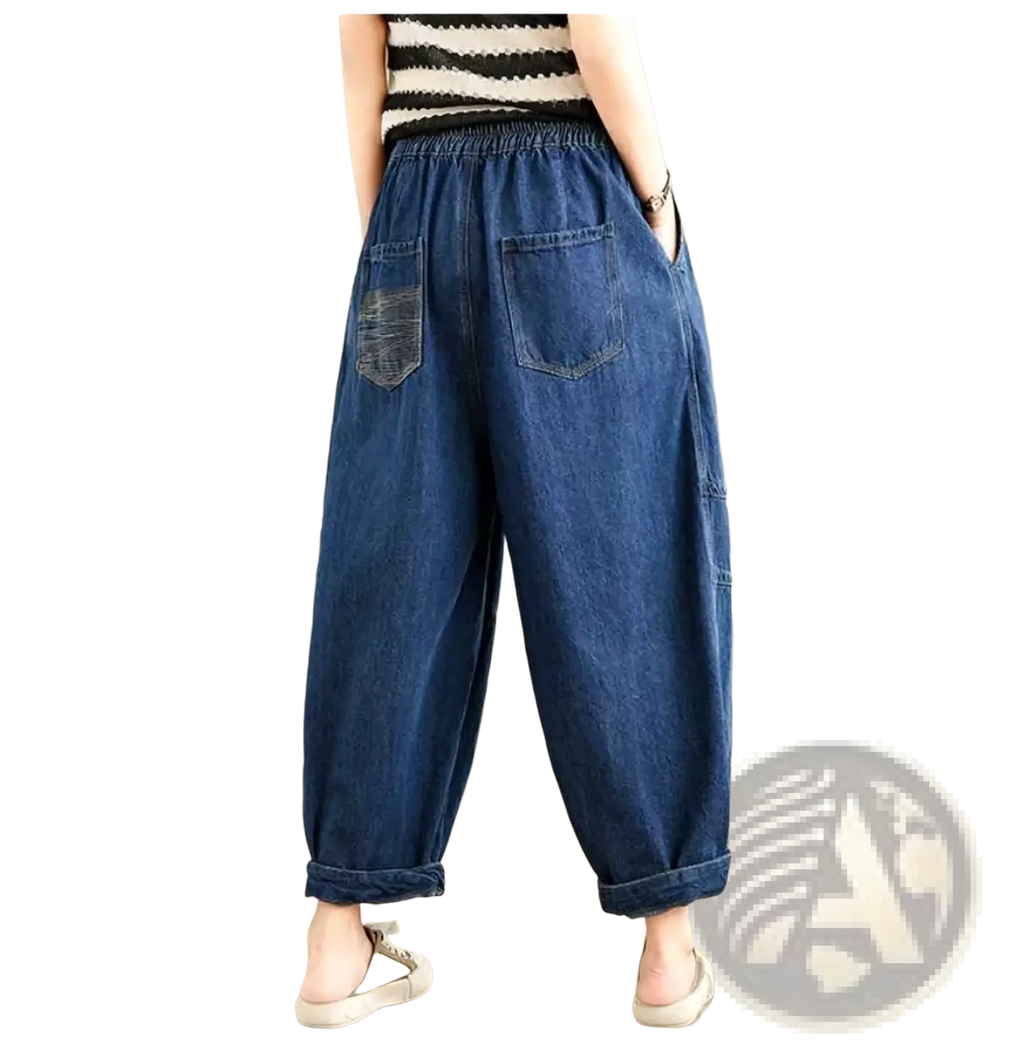 Blue denim wide leg denim harem pants for women featuring a relaxed fit and rolled cuffs casual jeans