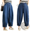 Wide leg denim harem pants for women in blue denim with rolled cuffs and patch pockets for casual wear