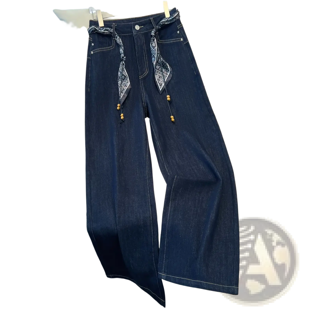 Wide leg dark blue denim jeans with high waist and patterned bandana belt with wooden bead accents