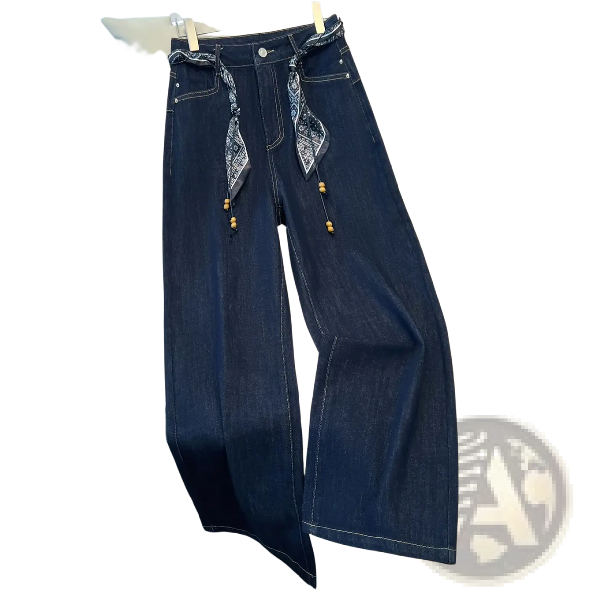 Wide leg dark blue denim jeans with high waist and patterned bandana belt with wooden bead accents