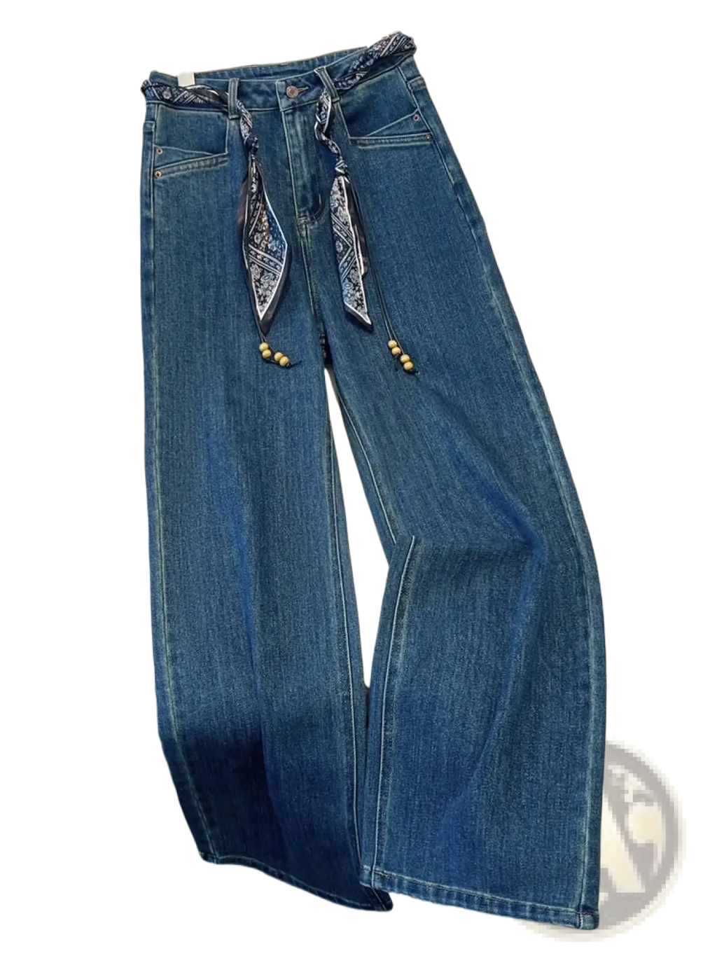 Blue denim wide leg jeans with decorative scarf belt featuring patterned fabric ties and wooden beads at the waist