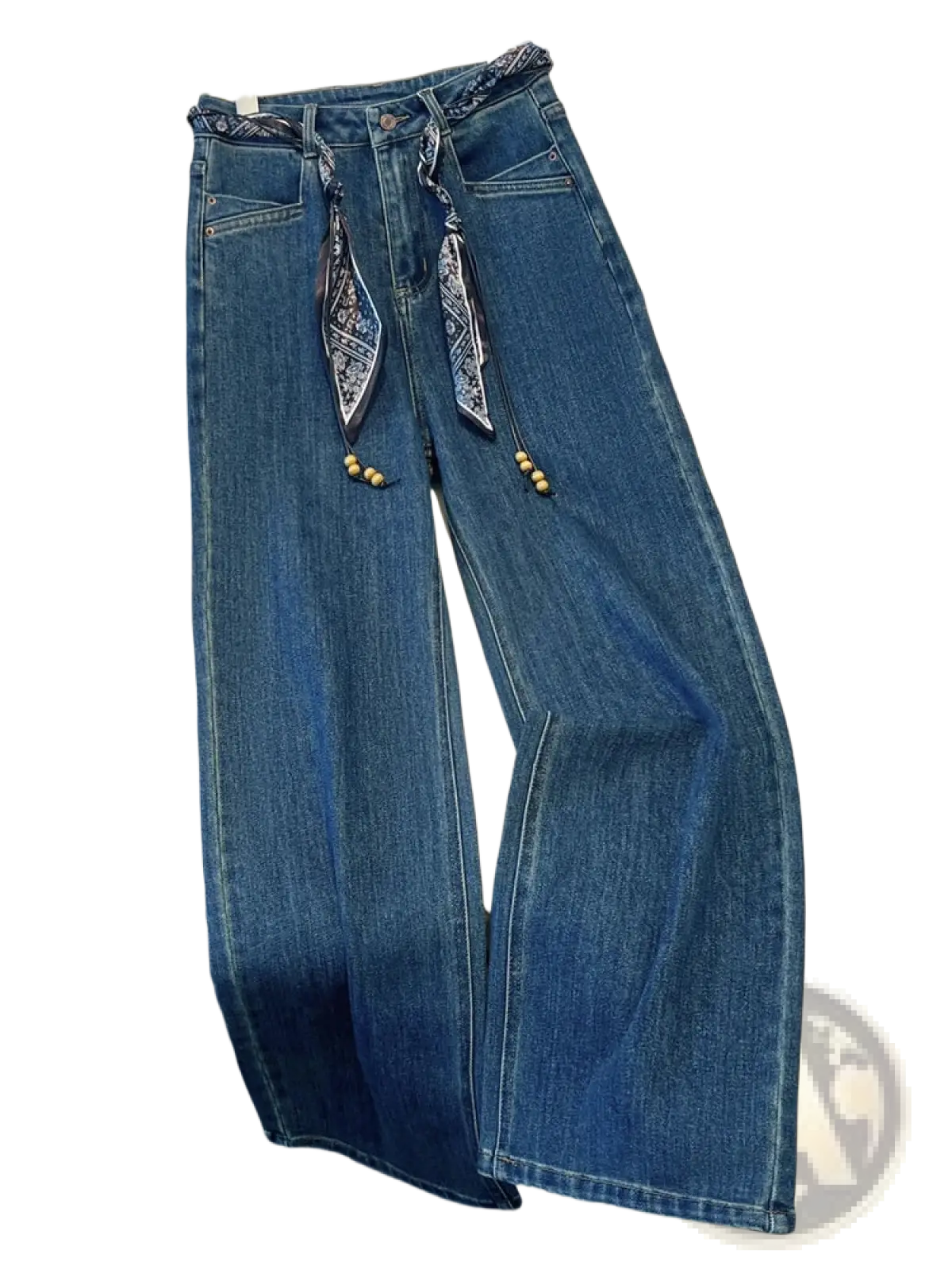 Blue denim wide leg jeans with decorative scarf belt featuring patterned fabric ties and wooden beads at the waist