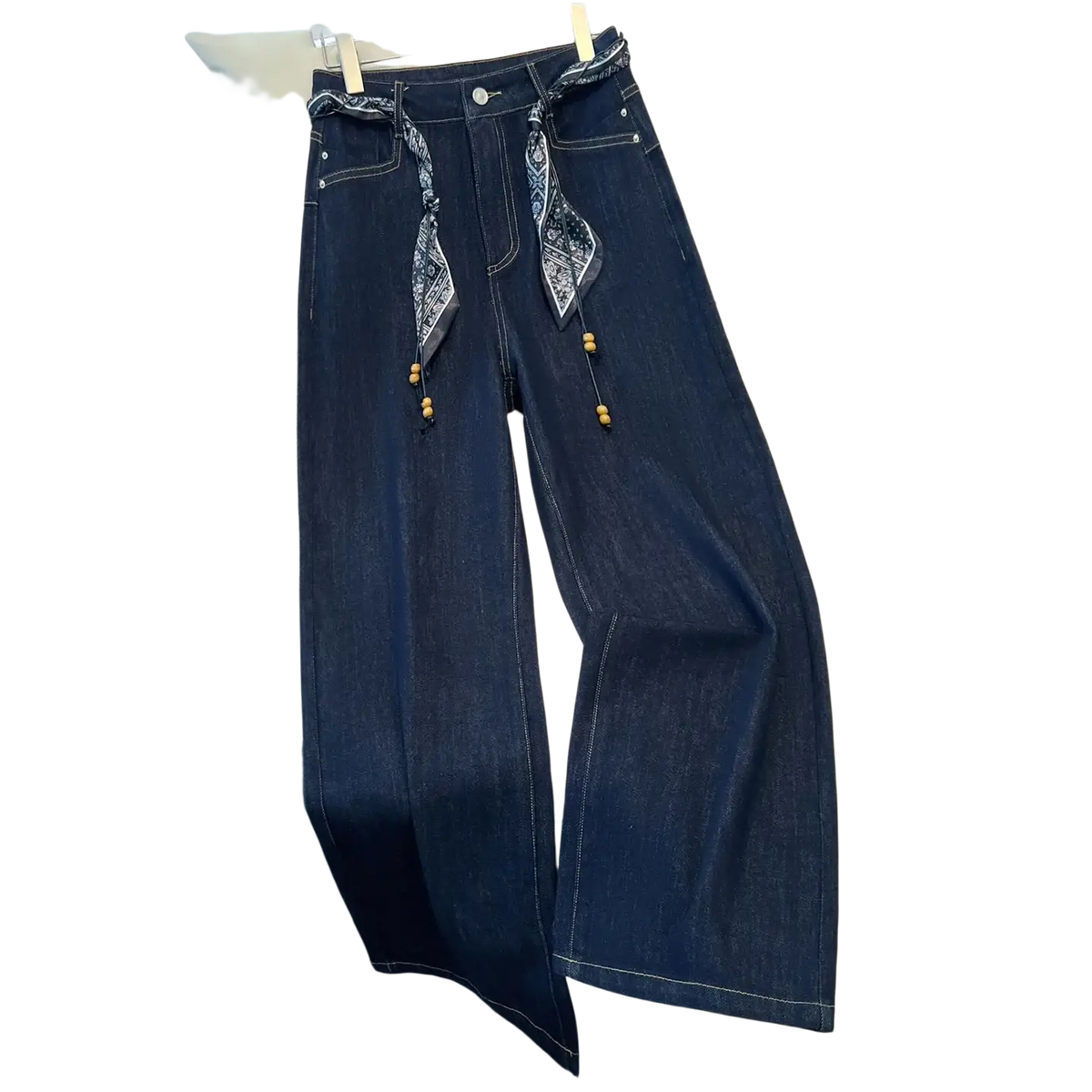 Wide leg dark blue denim jeans with high waist and patterned bandana belt with wooden bead accents