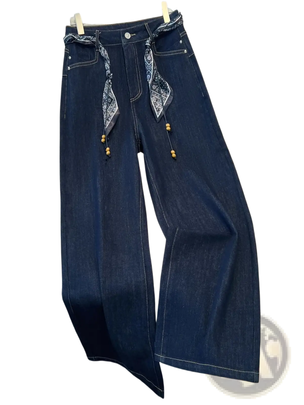 Wide leg dark blue denim jeans with decorative bandana scarf belt and wooden beads tied at the waist